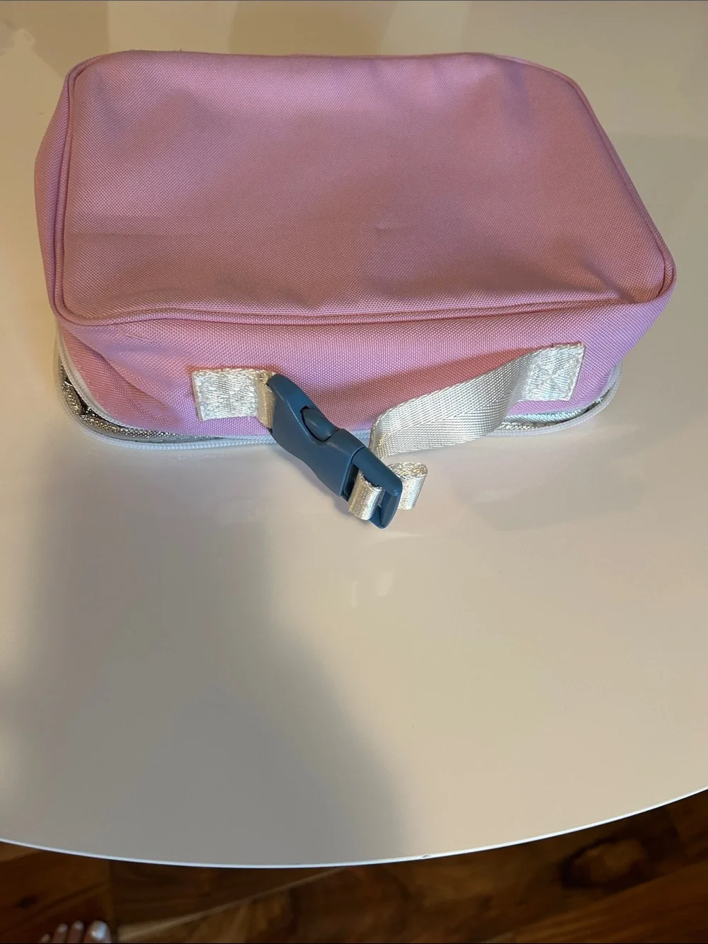 STATE Metallic Pink lunch box with Rainbow Accent with some wear .